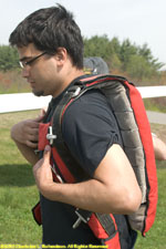Mo's son, Amir, getting into his parachute